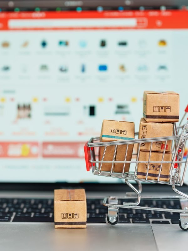 Boxes with shopping cart on a laptop computer. online shopping, Boxes with shopping cart