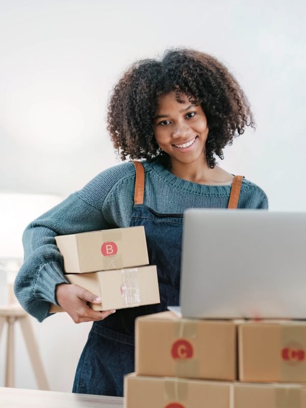 Startup small business entrepreneur SME, asian woman packing cloth in box. Portrait young Asian small business owner home office, online sell marketing delivery, SME e-commerce telemarketing concept. dropshipping person